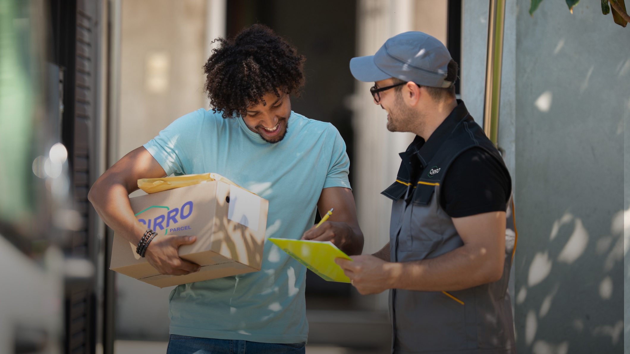 Delivery person handing a package to a customer at their doorstep, both smiling and engaging in a friendly interaction. The package is labeled with 'CIRRO Parcel'.